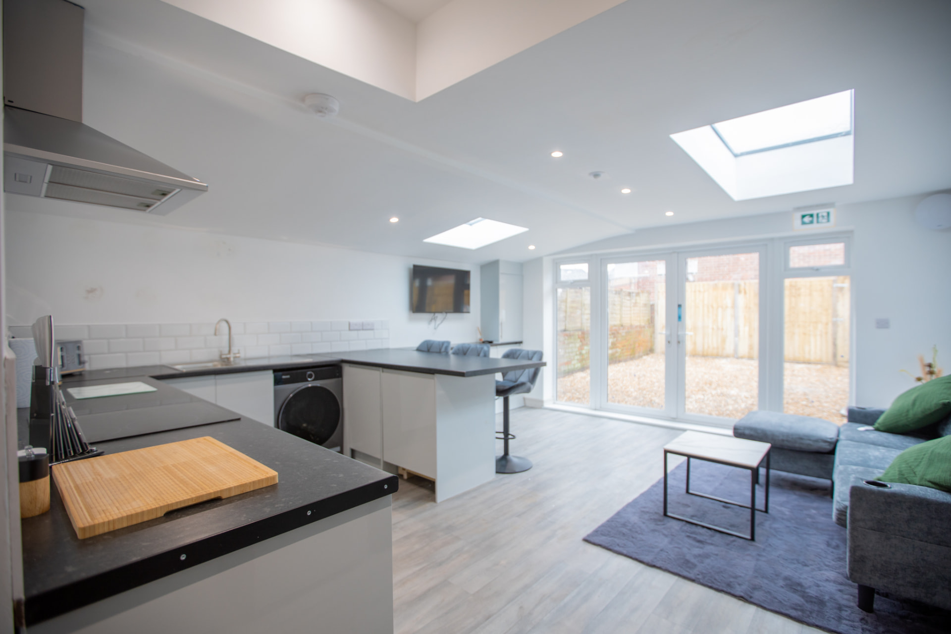 Fairham after — kitchen with bi-fold doors to courtyard